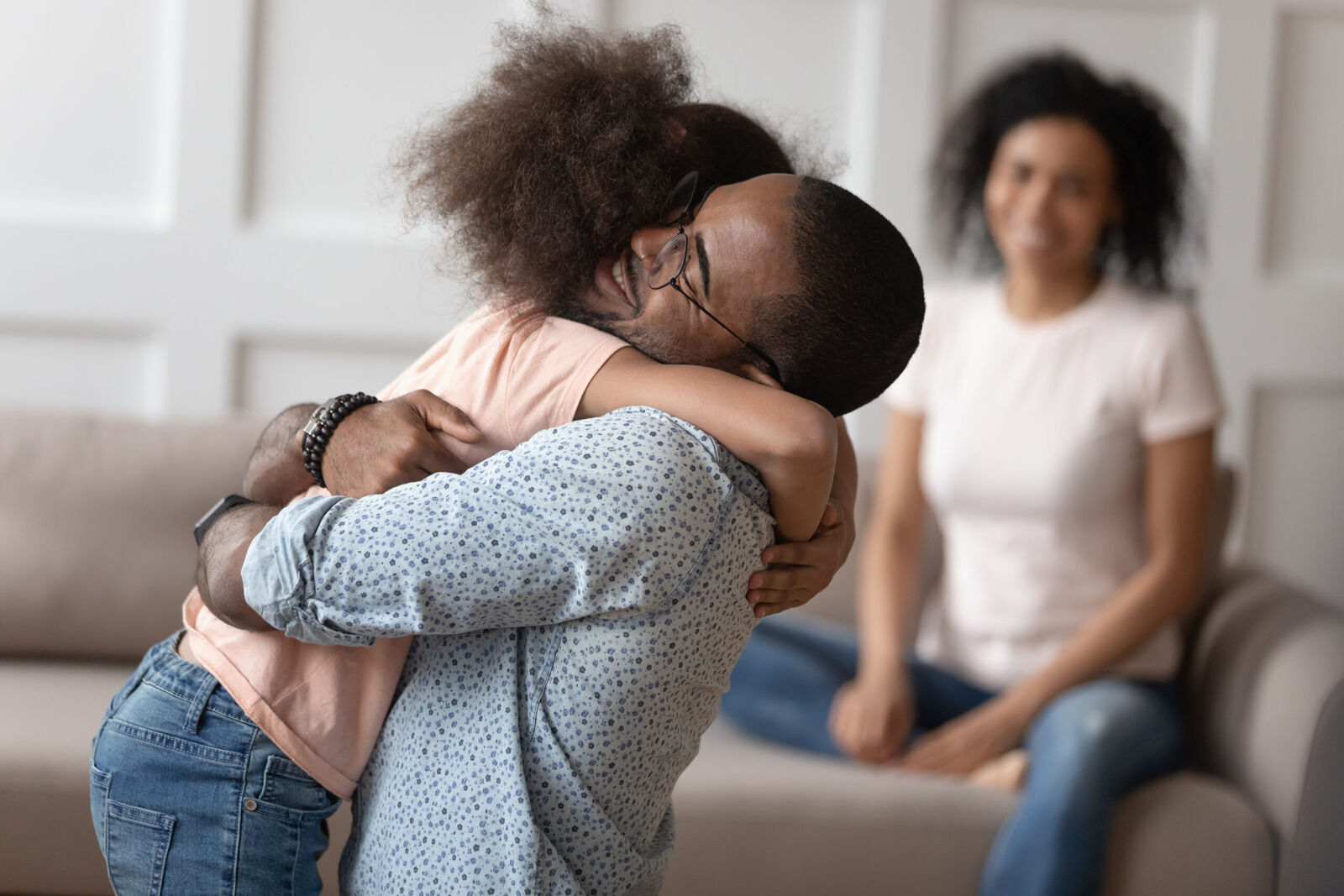 A family embracing at home after a release